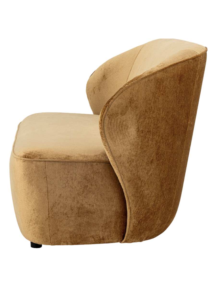 Modern camel brown velvet loveseat featuring a curved backrest, rounded arms, a plush bench seat, and a sculptural low-profile silhouette.