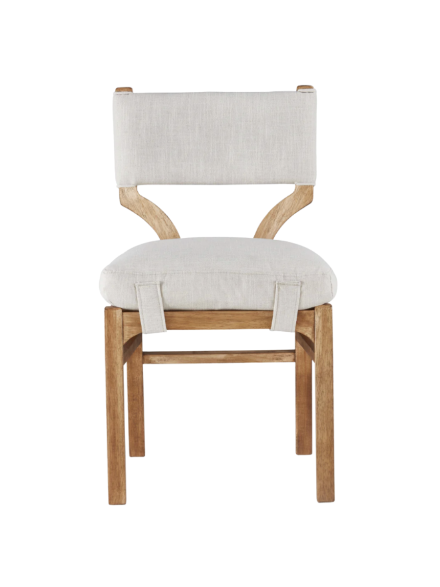 dining chair with wood frame + legs and cream upholstered back and seat with strap detail wrapping underneath seat.