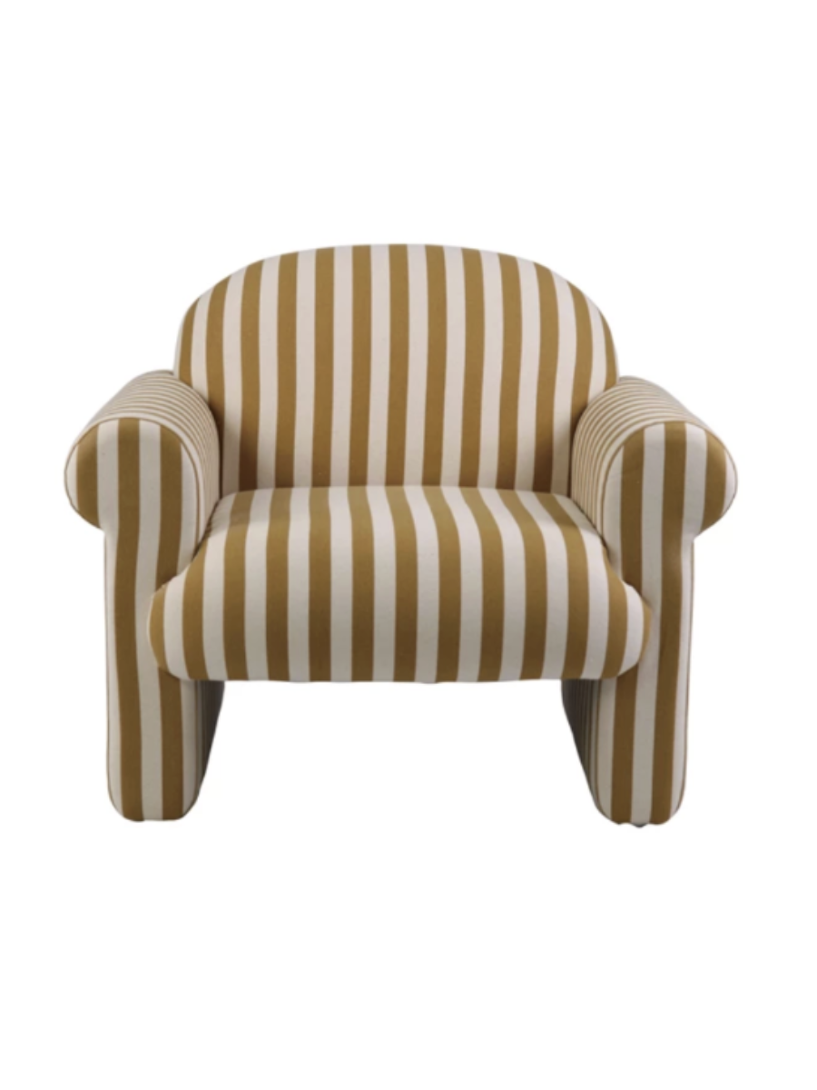 Modern accent chair upholstered in mustard yellow and cream striped fabric, featuring a rounded backrest, curved padded arms, and a plush cushioned seat.