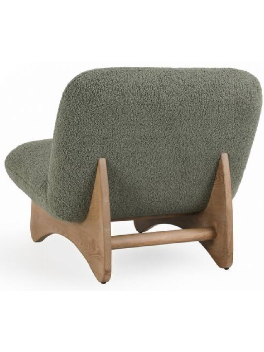 Back view of Modern armless accent chair upholstered in sage green bouclé fabric with a curved backrest, wide cushioned seat, and natural wood base.