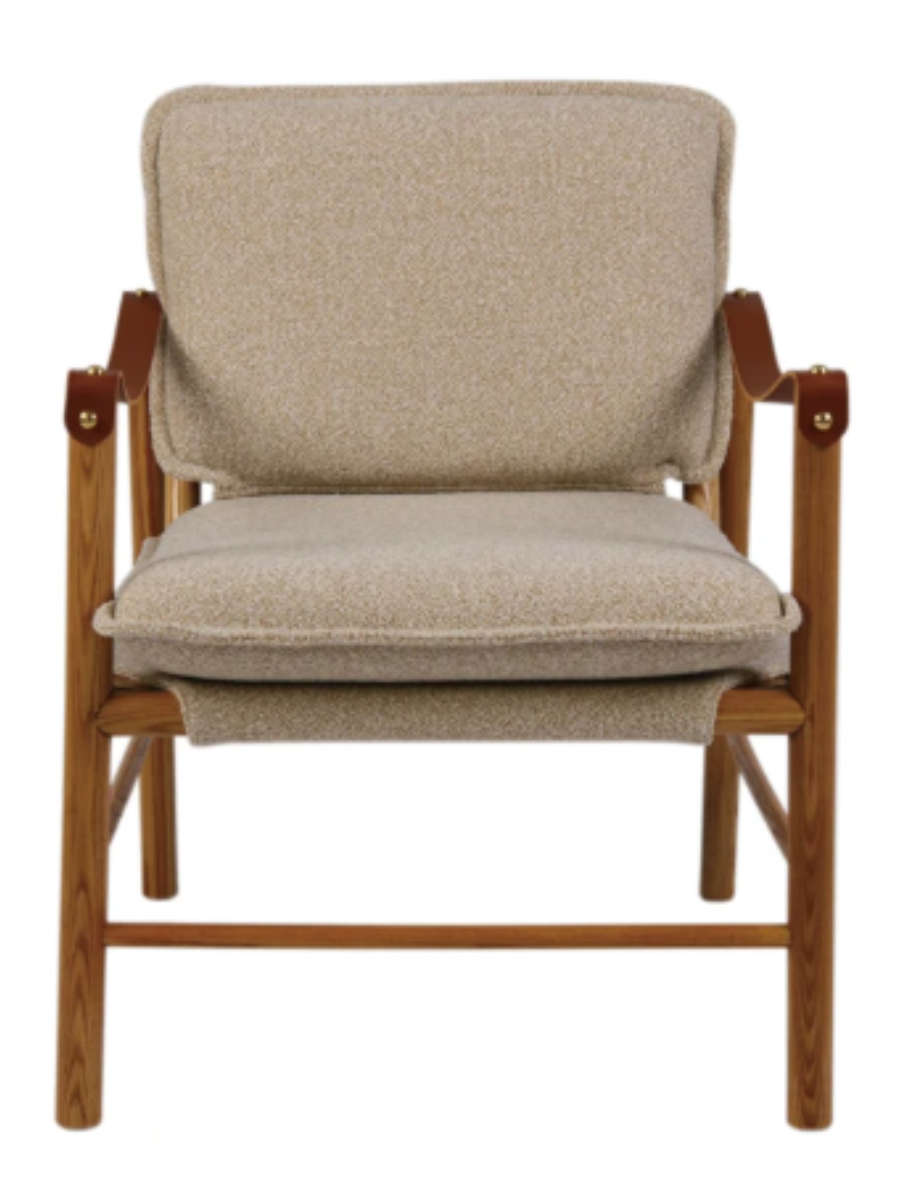 Mid-century modern accent chair with beige upholstered cushions, a natural rubberwood frame, and cognac leather sling armrests with brass accents.
