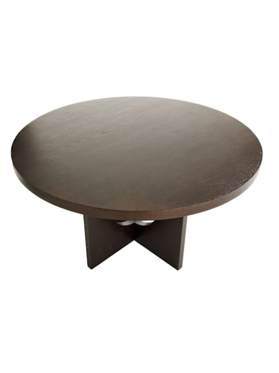 Modern round dining table in dark walnut wood finish, featuring a thick circular tabletop and sculptural intersecting pedestal base with circular cutout details. Top view.