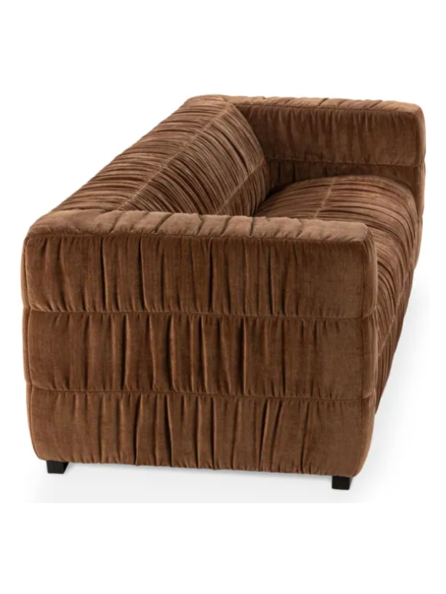 Modern camel brown velvet sofa featuring gathered ruched upholstery, wide square arms, a deep bench seat, and a low-profile silhouette.
