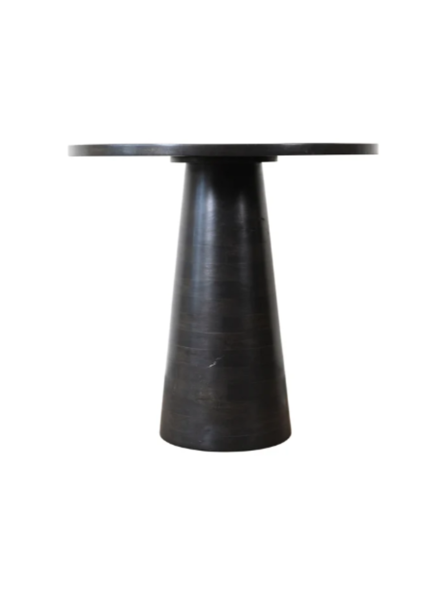 Modern round dining table in a dark charcoal wood finish, featuring a smooth circular tabletop and sculptural tapered pedestal base.