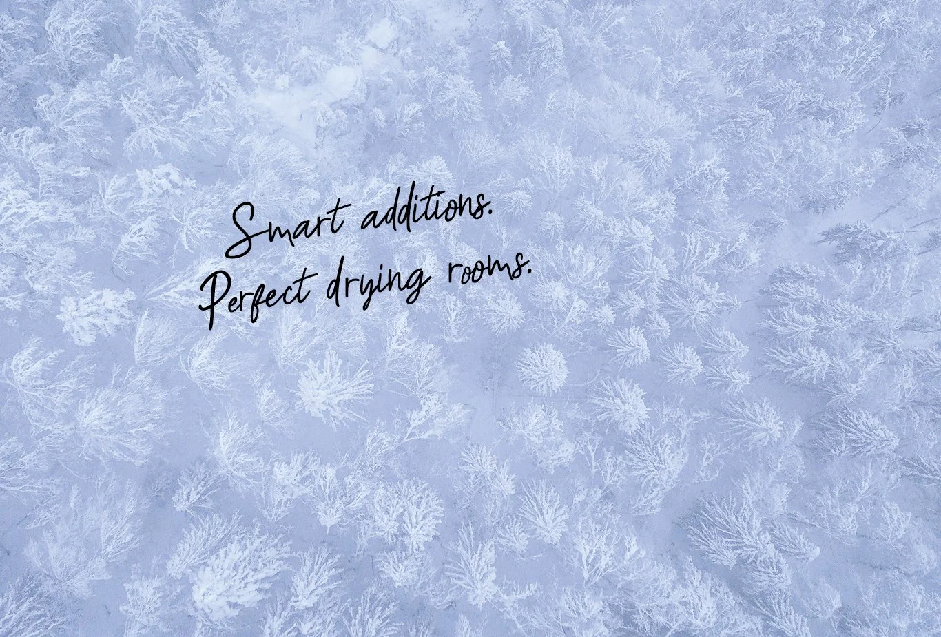 A frosty window with snowflake patterns and the text 'Smart additions. Perfect drying rooms.' written over it.