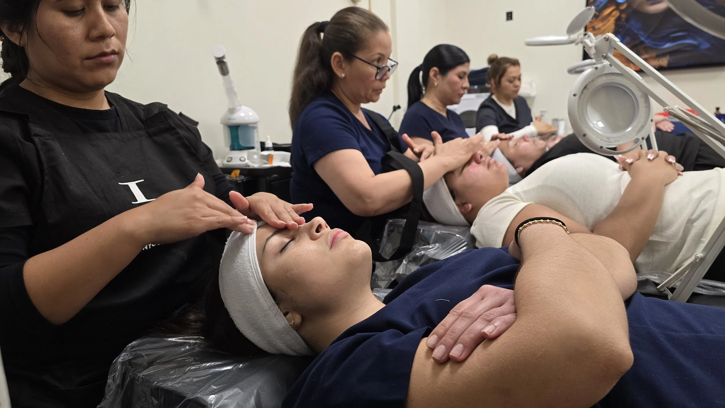 Women receiving facials or skincare treatments in a spa or medical setting, with practitioners applying skincare products to their faces.