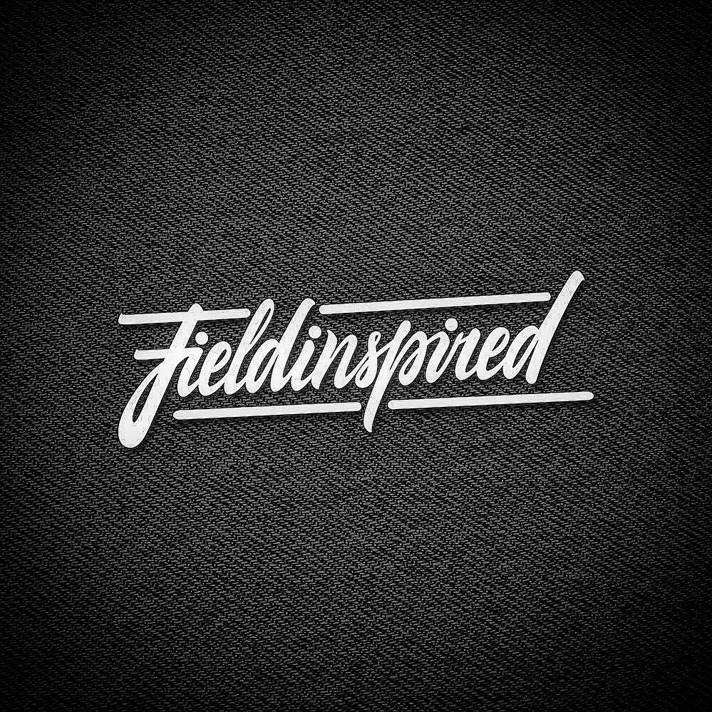 A black textured background with white script text reading 'fieldinsolved'.