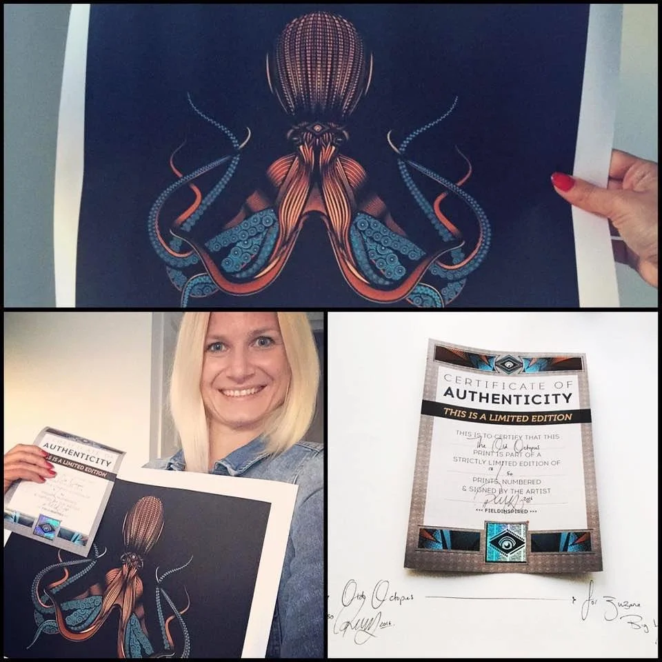 Woman holding a print of an octopus artwork and a certificate of authenticity for the print.
