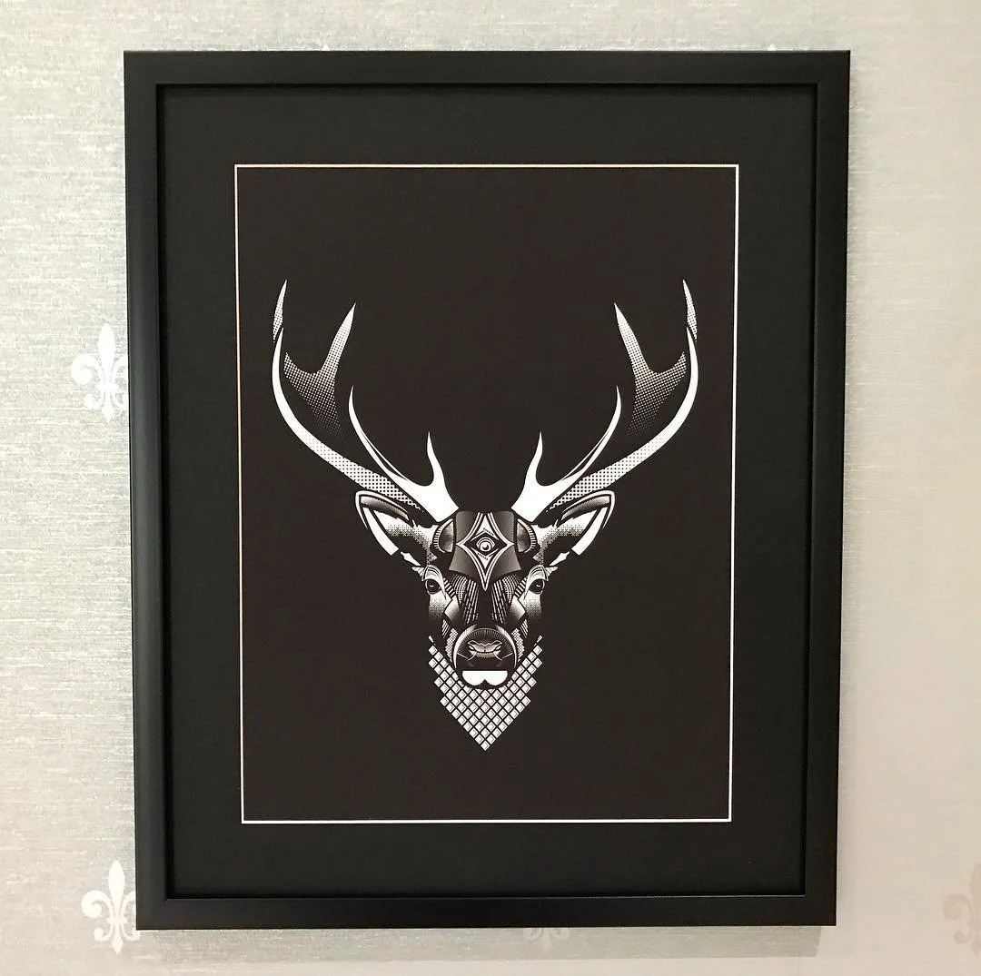 Stylized black and white geometric art of a deer's head with antlers.