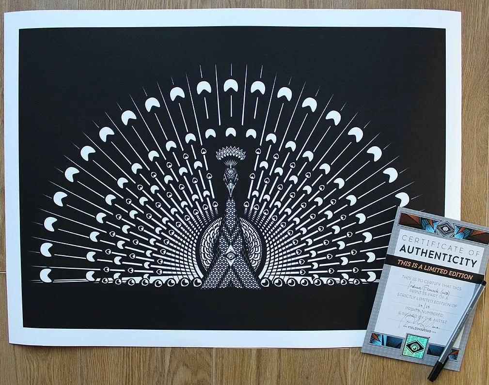 Black and white artwork of a peacock with its feathers spread wide, featuring intricate geometric patterns. A limited edition certificate of authenticity is partially placed on the bottom right corner of the image.