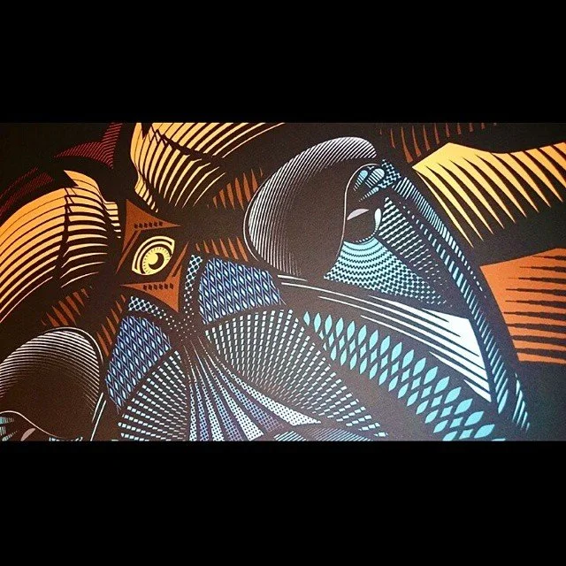 Abstract digital artwork with geometric shapes and patterns in shades of blue, black, brown, and beige.