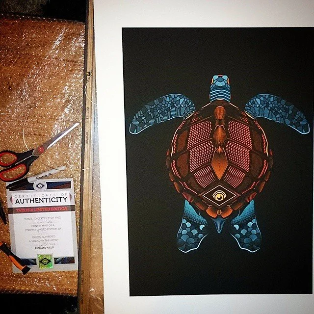 Artwork of a sea turtle with colorful geometric patterns on a black background.