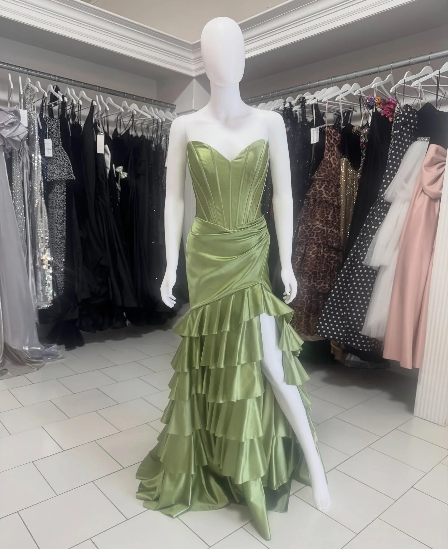 ALL the things for spring! Sage, ruffles, corset, slit- what else could you want???? We are here until 6:00!! #prom #prom2026 #formal #gown #formalwear
