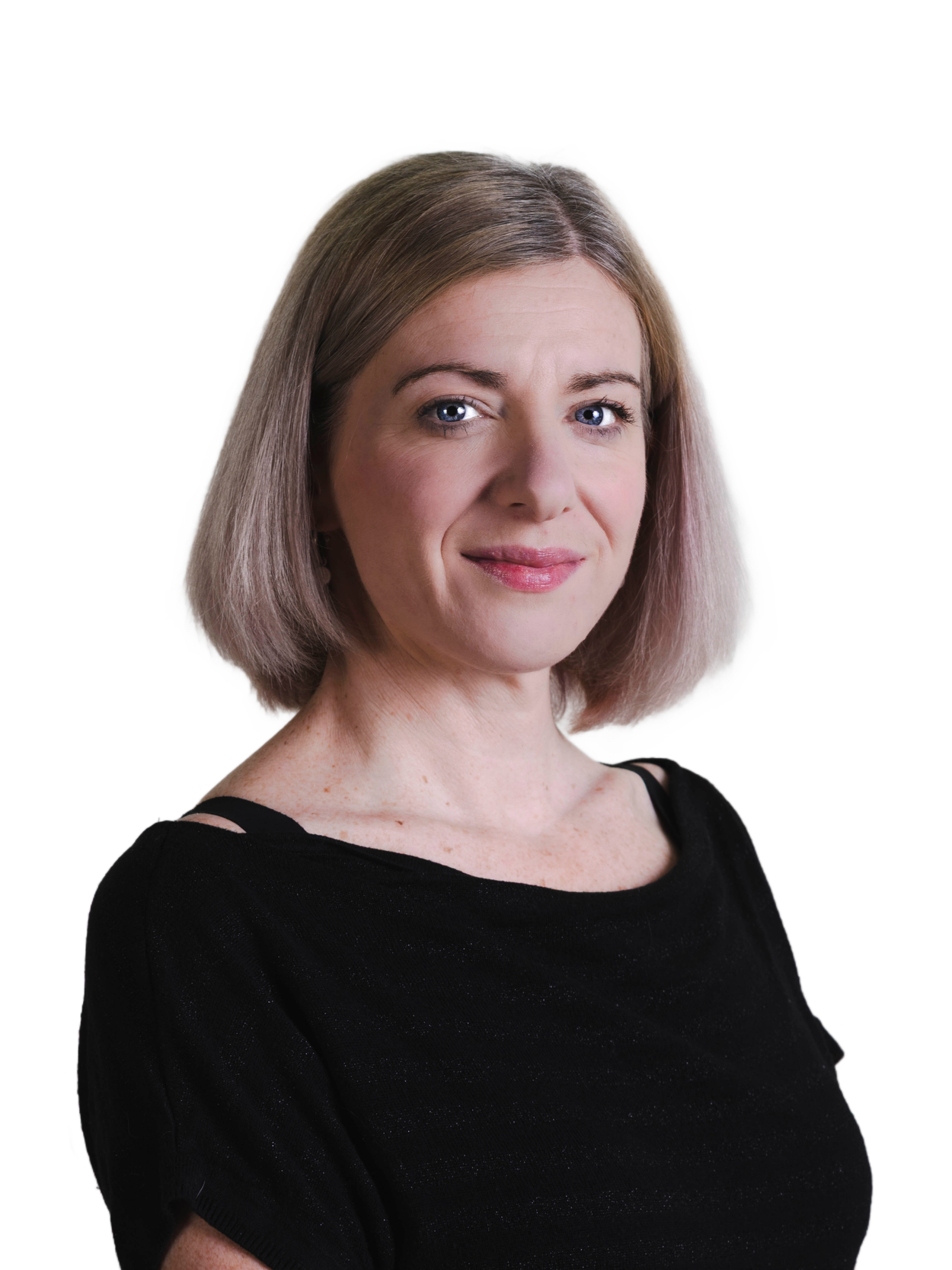 Portrait of a woman with shoulder-length blonde hair, blue eyes, and a gentle smile, wearing a black top.