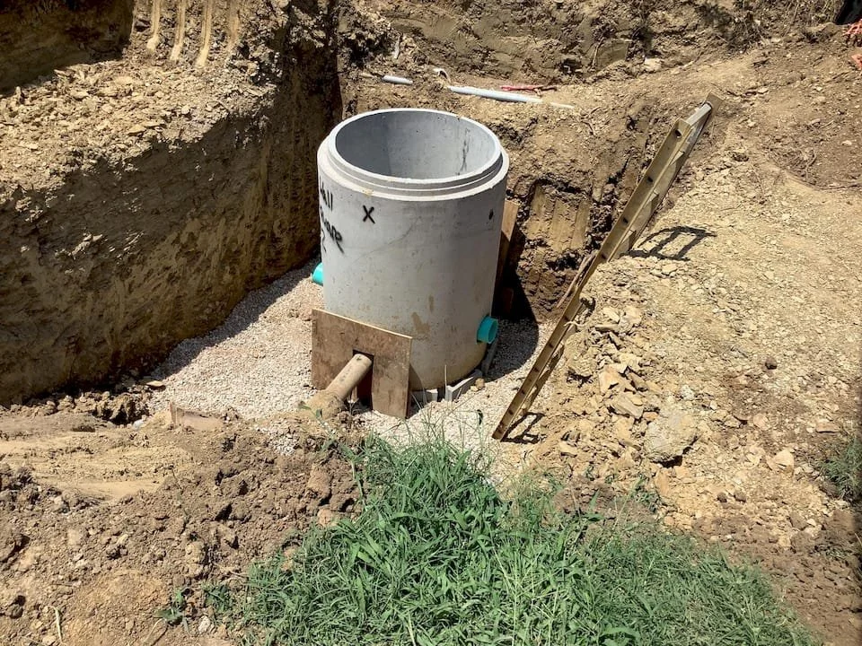 Concrete storm structure shown during construction.