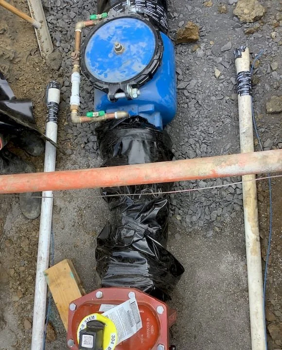 Underground waterline shown during construction.