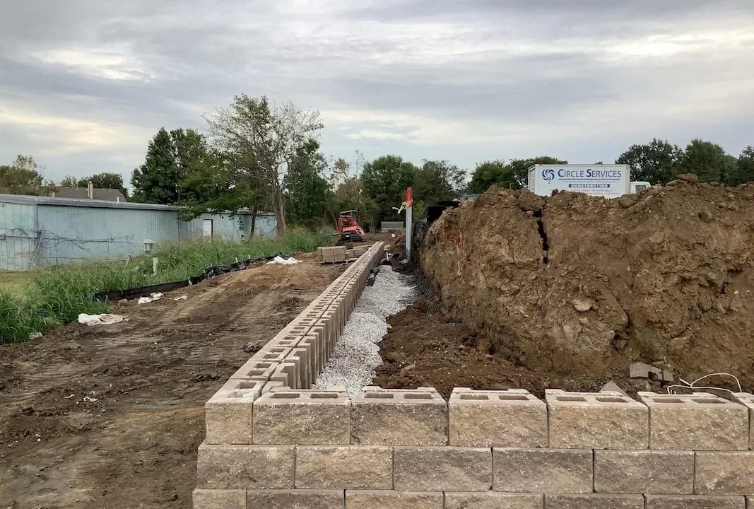 Segmental retaining wall construction and site grading during civil development for Warren Clinic medical campus in Coweta Oklahoma