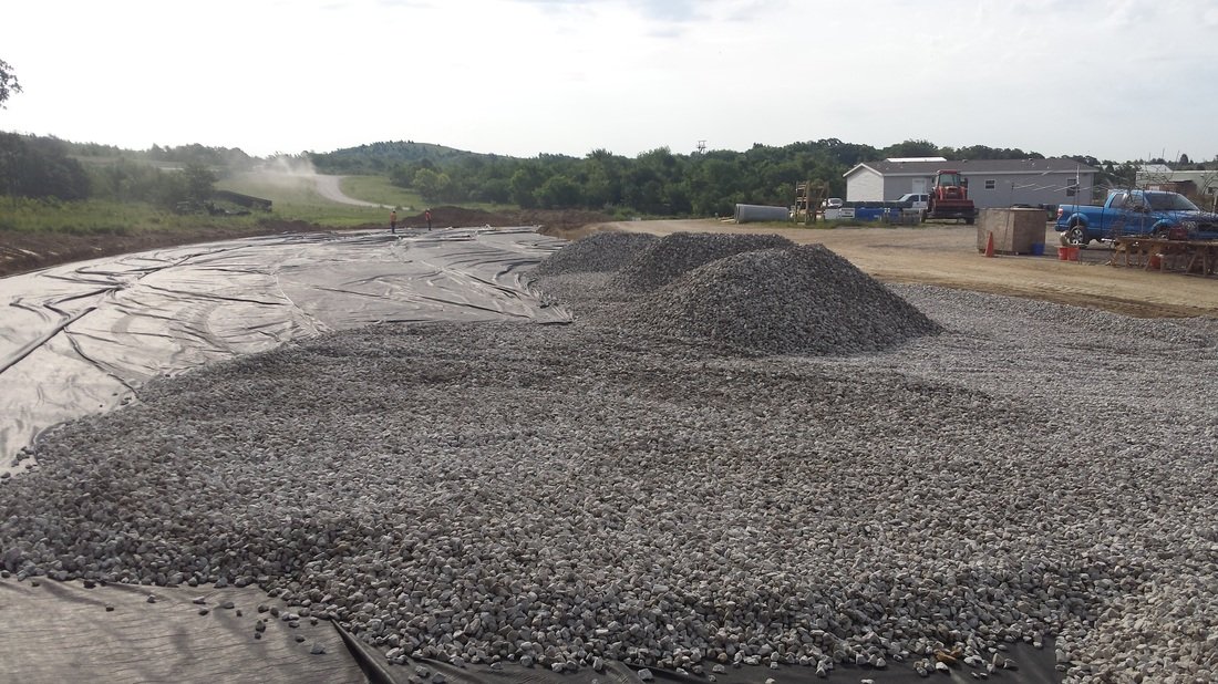 Aggregate base material installed and graded for site foundation.