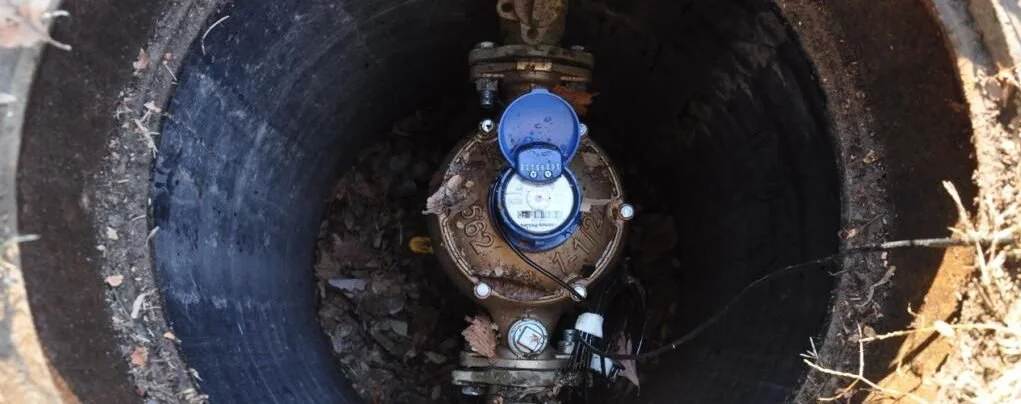 Water meter installed on an underground water service line.