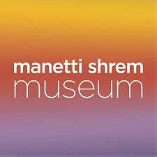 Text that reads 'Manetti Shrem Museum' on a gradient background with warm colors