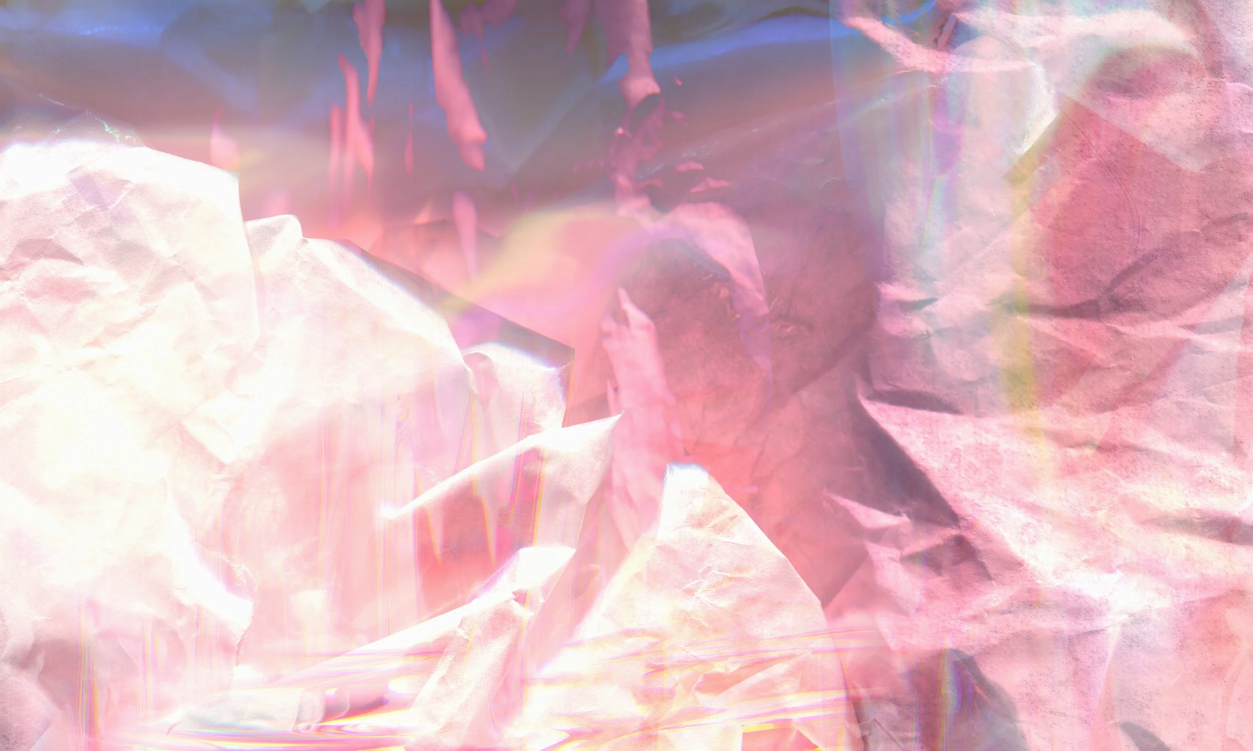 A close-up of crumpled pink and purple tissue paper with iridescent reflections and light.