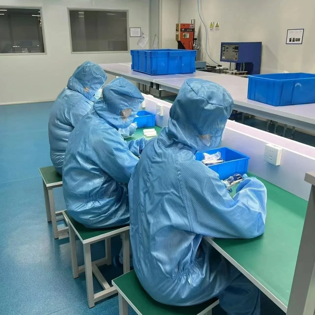 Medical device assembly and quality control performed by staff wearing PPE in a controlled environment