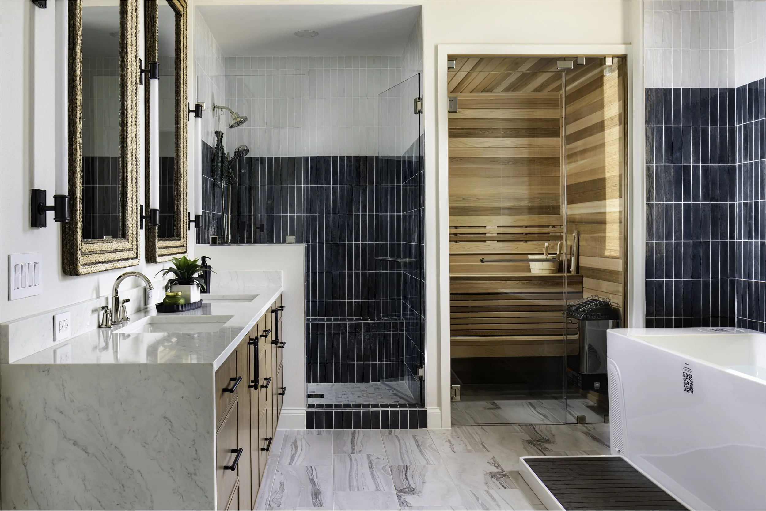 Modern bathroom with a dual vanity and marble countertop, black fixtures, a shower with black tile, a wooden sauna, and a walk-in bathtub.