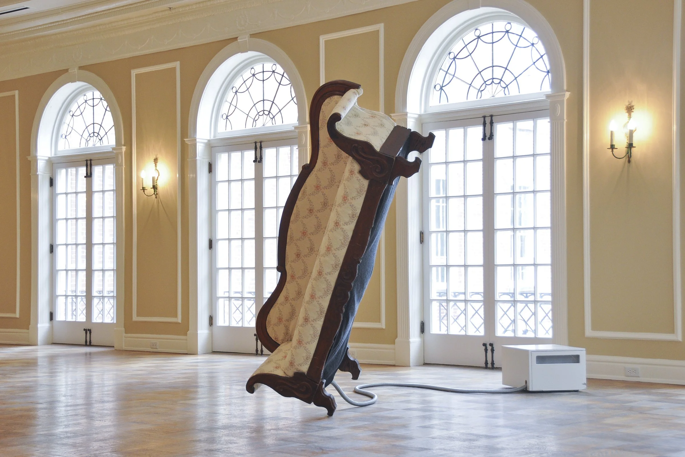 sofa balancing on one leg