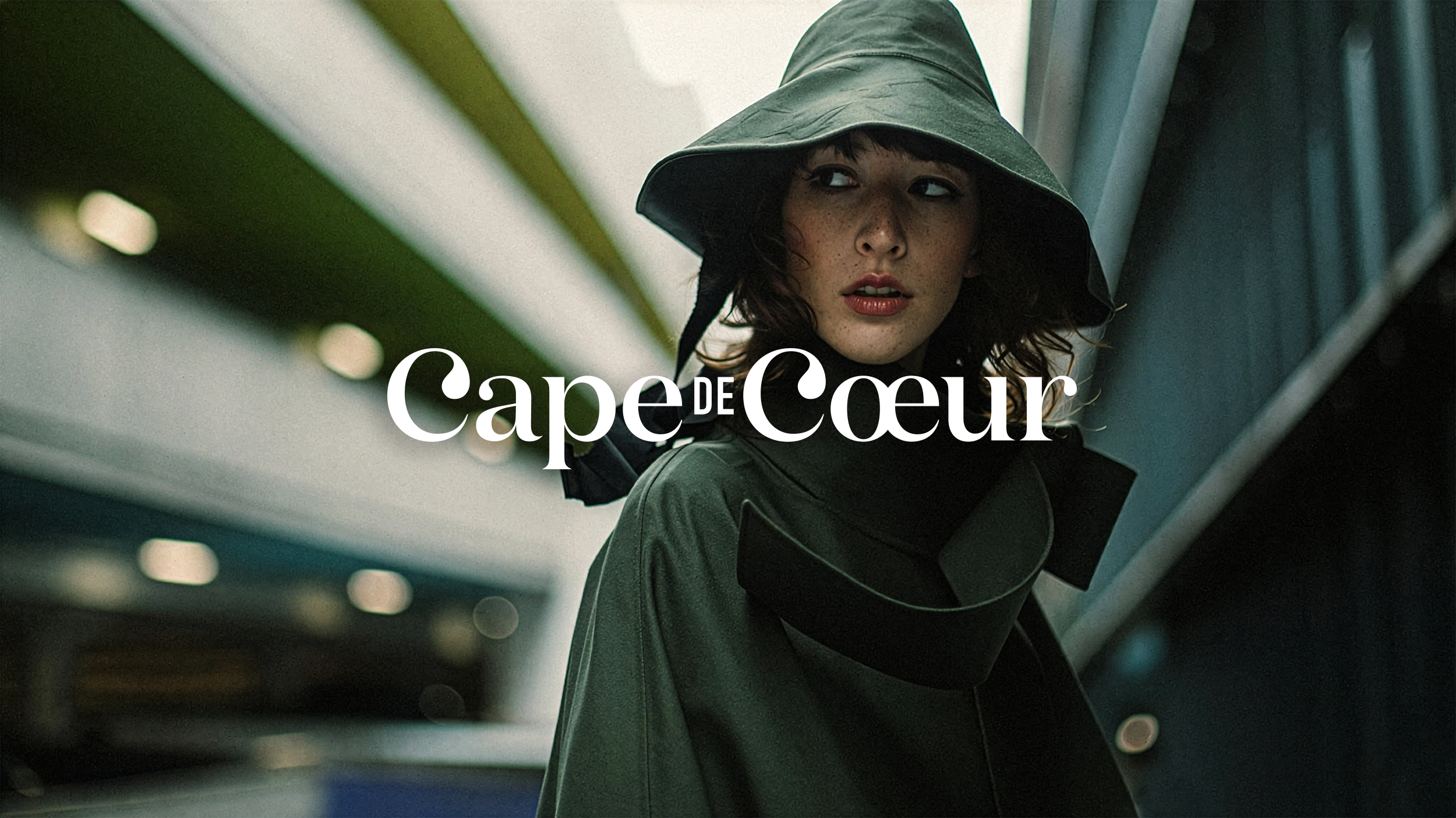 Cape de Coeur luxury fashion photography art direction featuring rainwear hat.