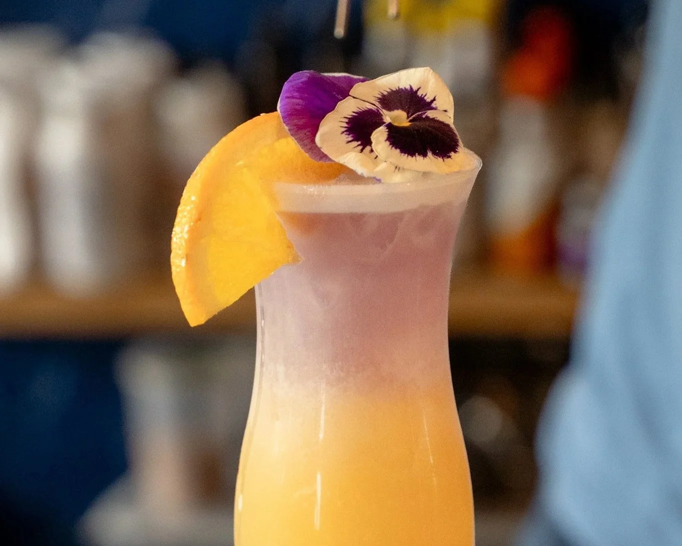 A martini cocktail with olives