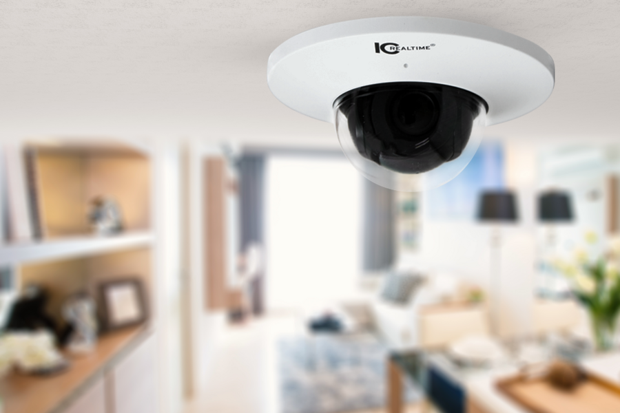 Indoor security camera mounted on the ceiling in a living room.