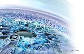 Abstract artwork featuring a circular, icy blue design with icy textures and patterns.