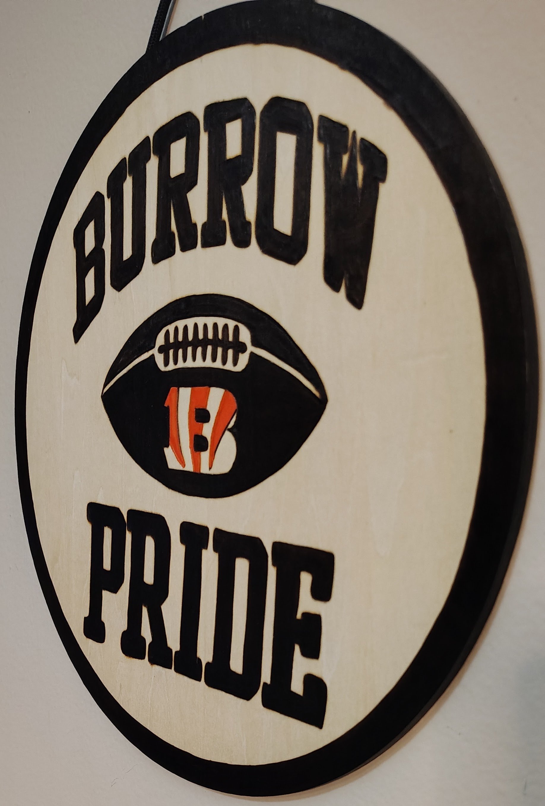 A handmade wood-burned sign featuring the Joe Burrow Cincinnati Bengals Fan Pride Sign