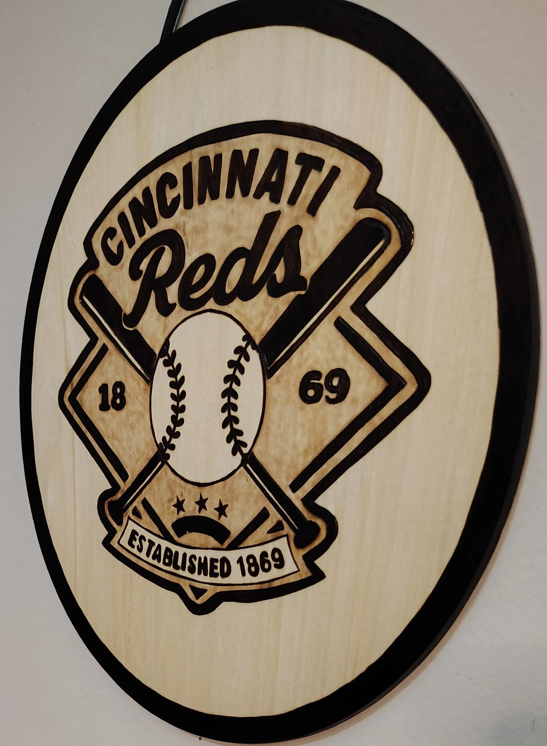 a handmade wood-burned sign of a Vintage Cincinnati Reds Baseball Field Sign
