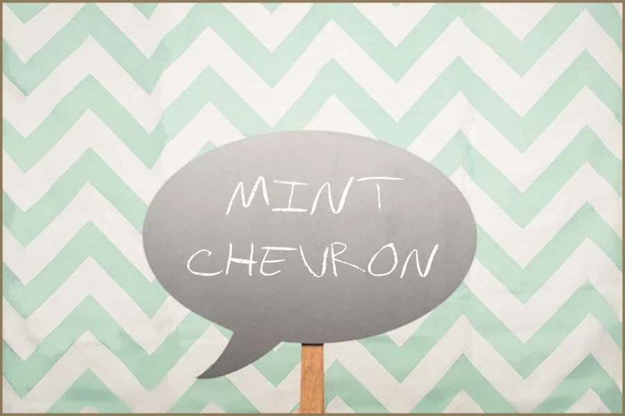 A chalkboard speech bubble with the words "Mint Cheuron" written in white chalk-style text, set against a green and white chevron patterned background.