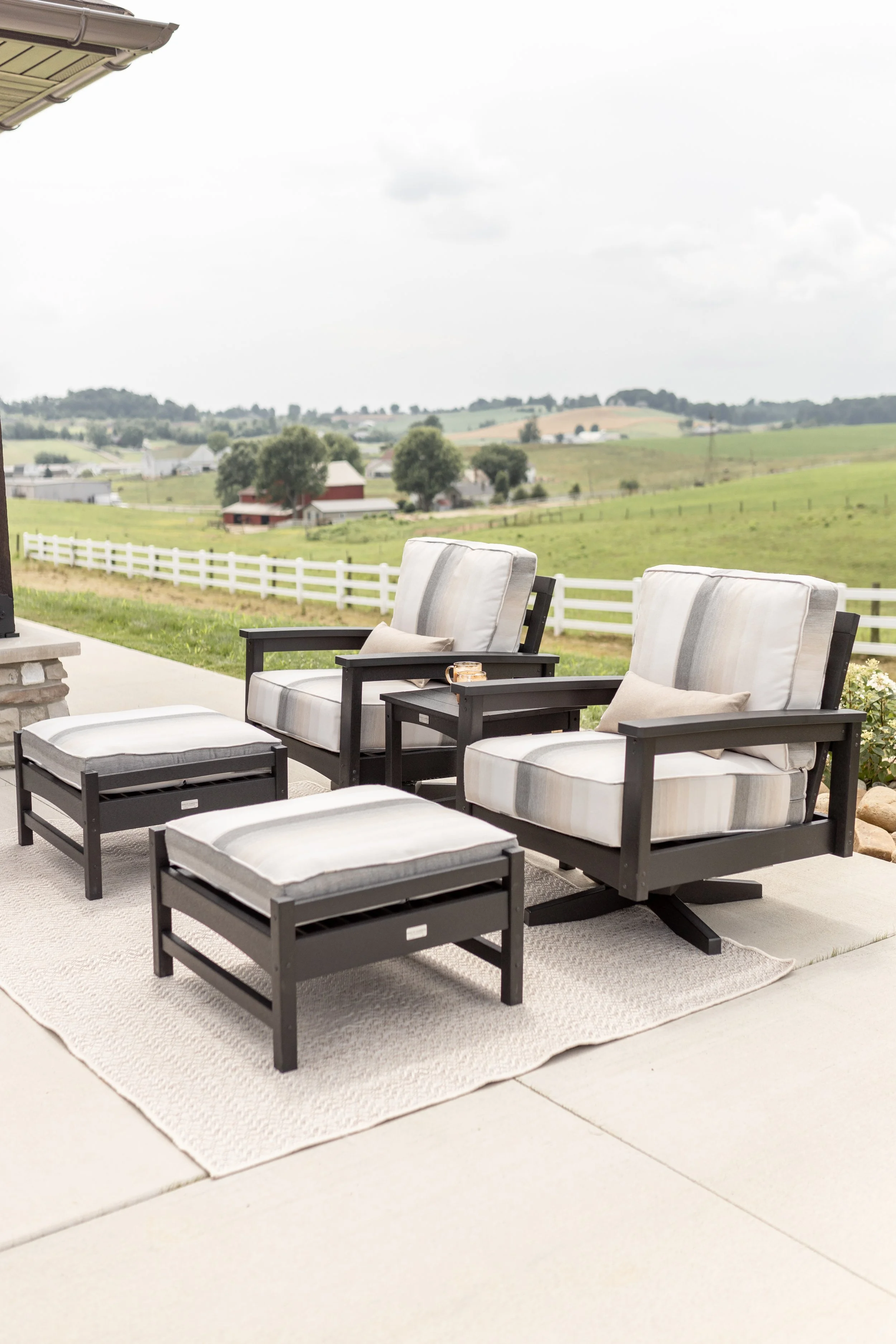Camden Swivel Rockers, Ottomans, and End table in black.jpg