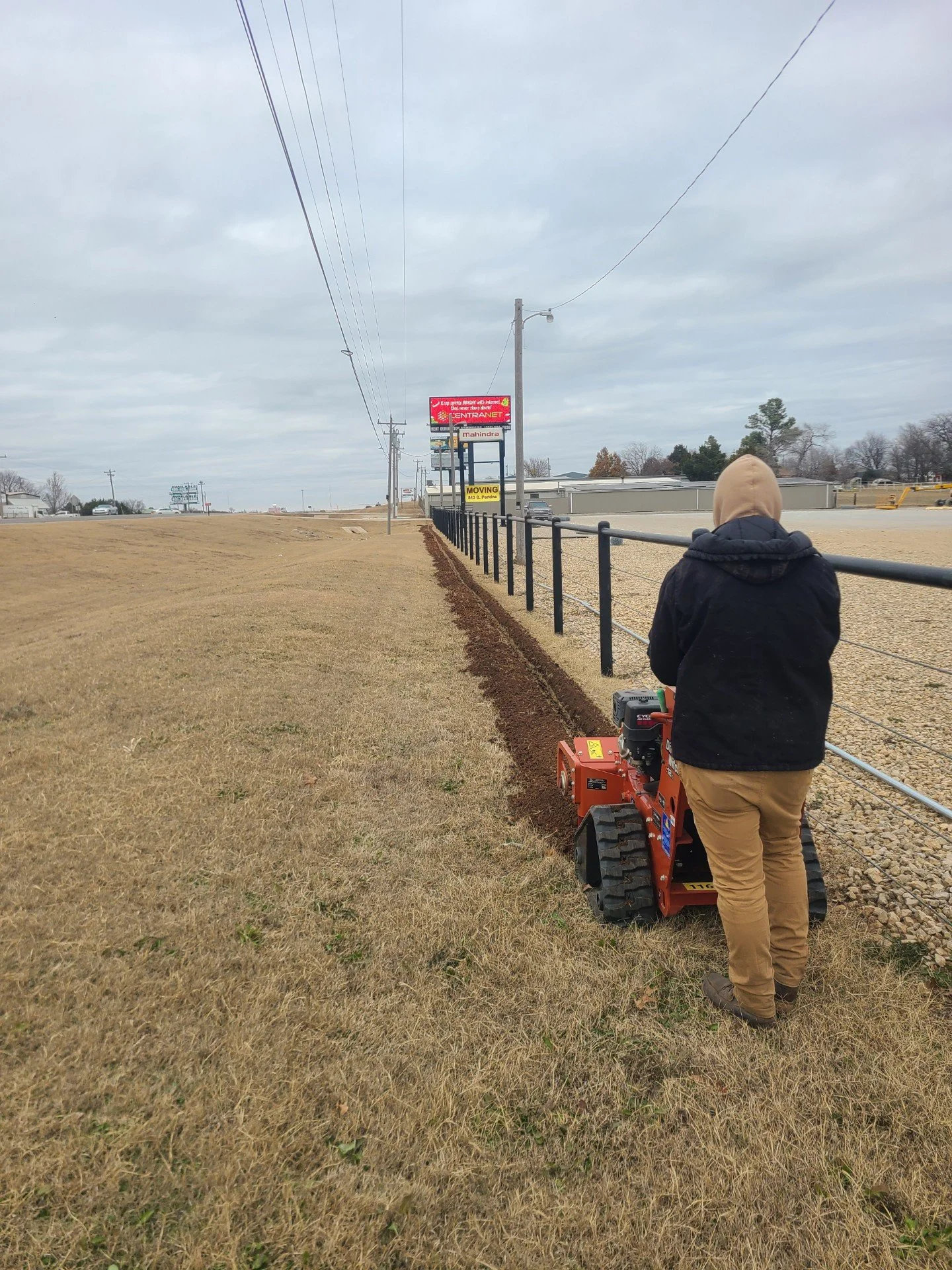 Rescomm technician working on a trench