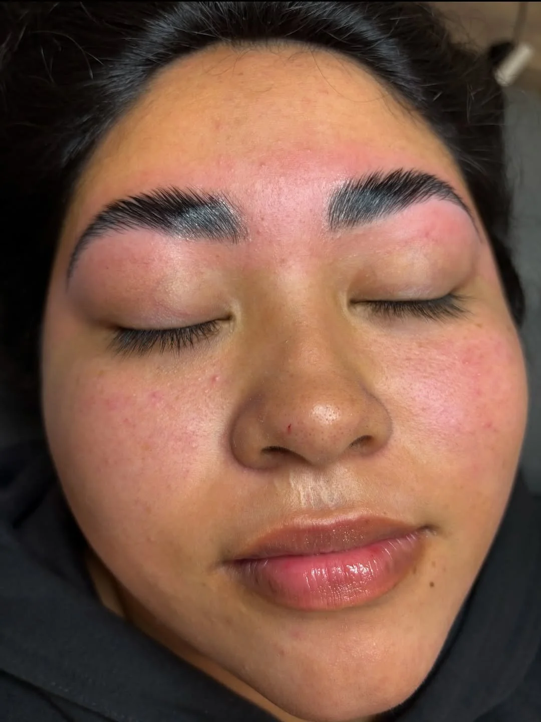 Freshly shaped and groomed eyebrows immediately after brow lamination service