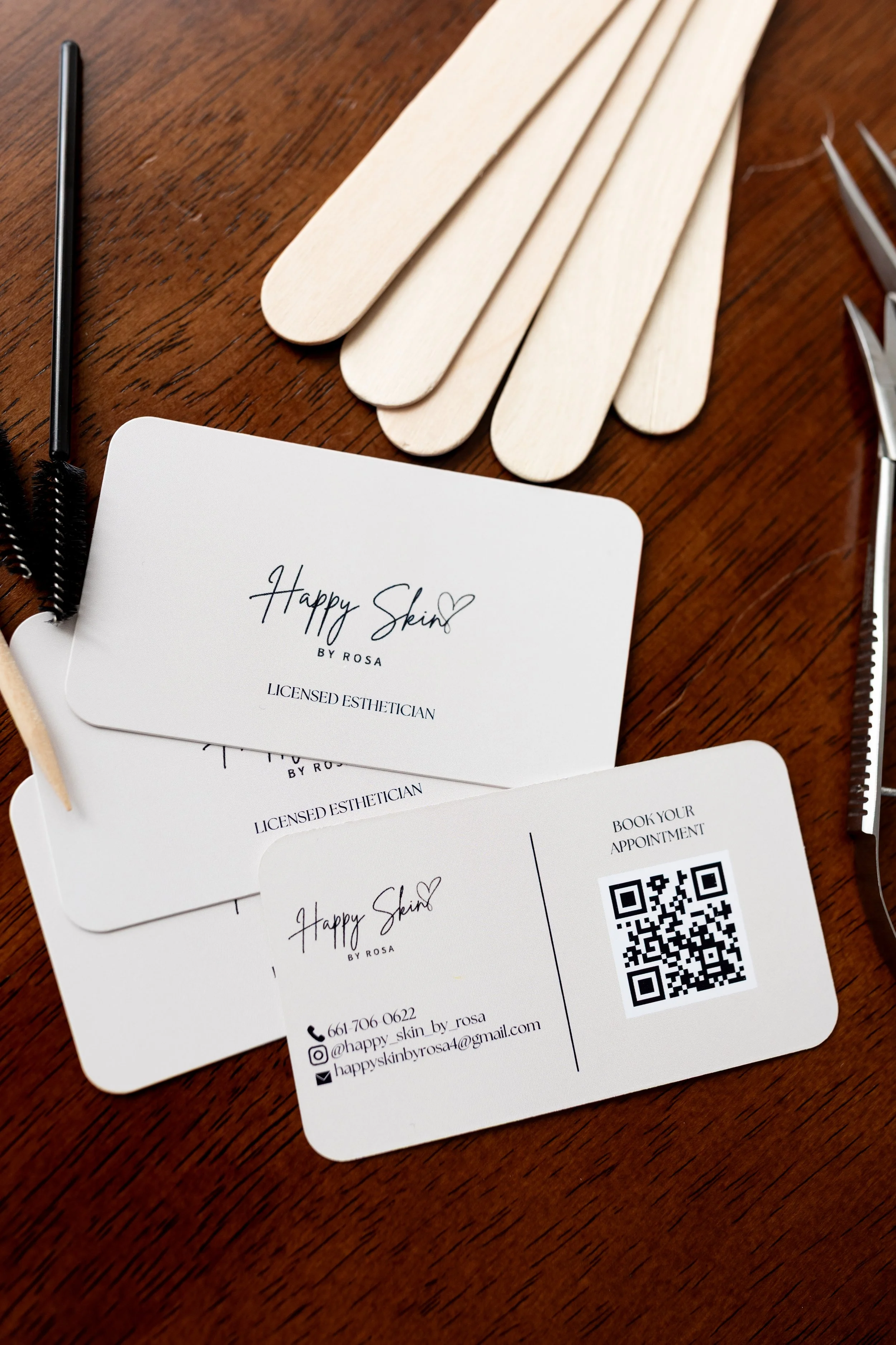 Waxing tools and skincare products displayed on esthetician workspace for hair removal services