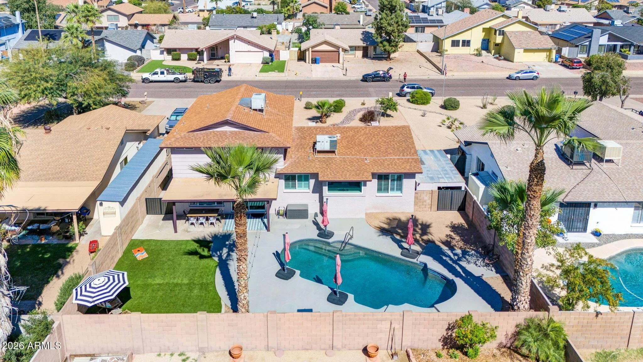 The low-maintenance backyard features a private pool and synthetic turf, delivering a move-in ready outdoor lifestyle highly sought after in the 85023 zip code.