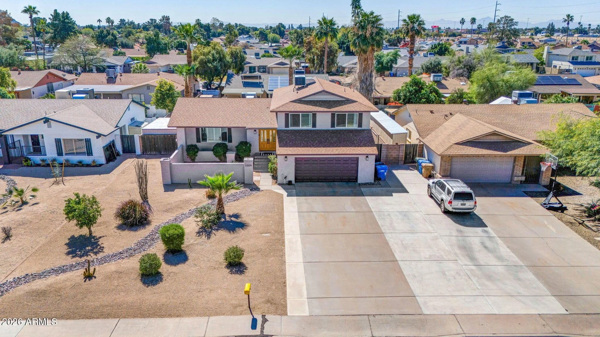 2509 W Acoma Dr in Phoenix's Thunderbird Valley offers robust block construction, an attached 2-car garage, and 6 slab parking spaces with No HOA.