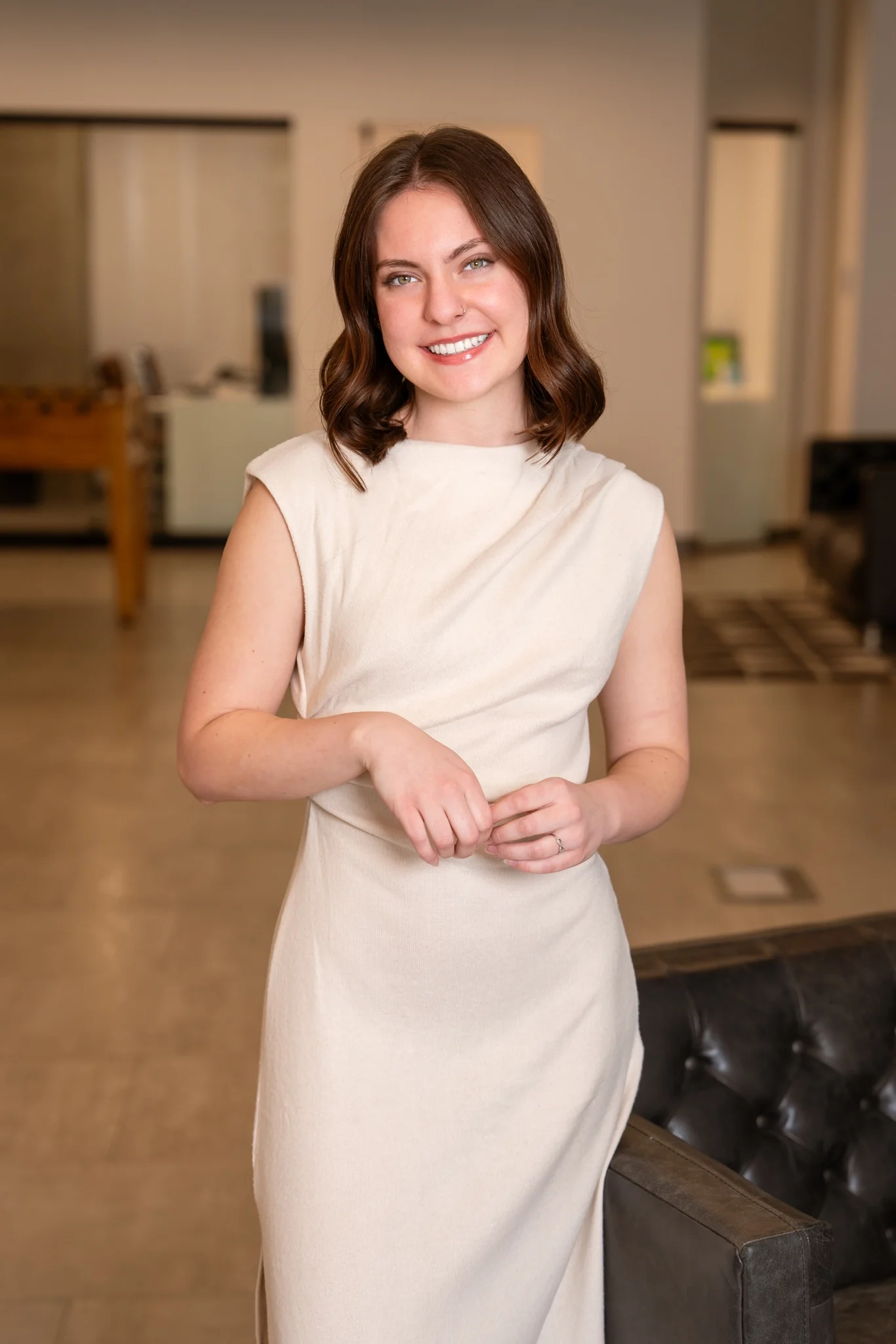 Dakota Taylor headshot wearing a beige dress.