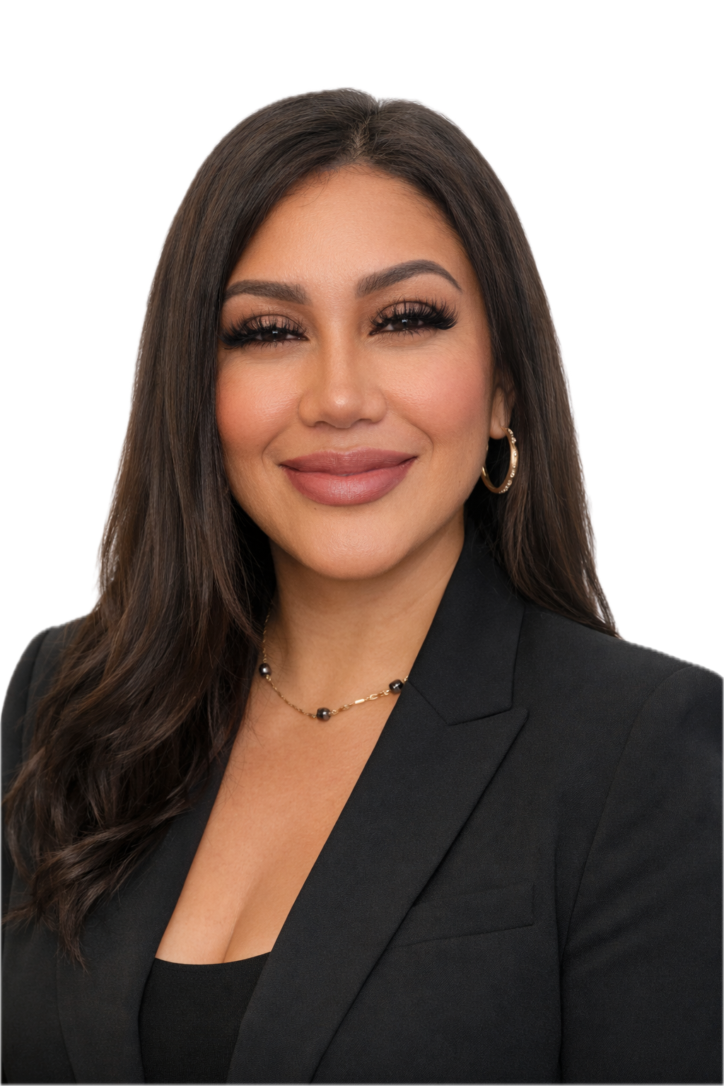 A headshot of a woman with long dark hair, wearing a black blazer and jewelry, smiling against a professional background.