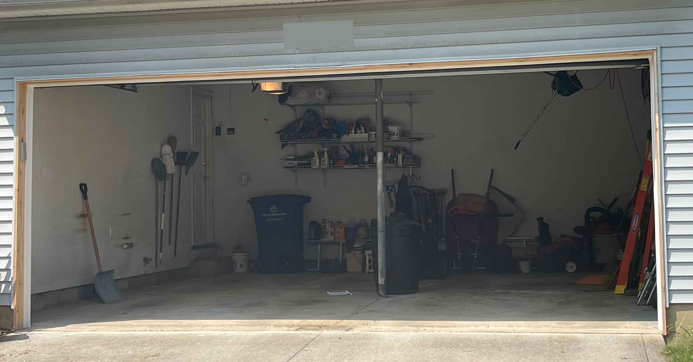 After Replacement: Single 18-by-8 foot garage door opening