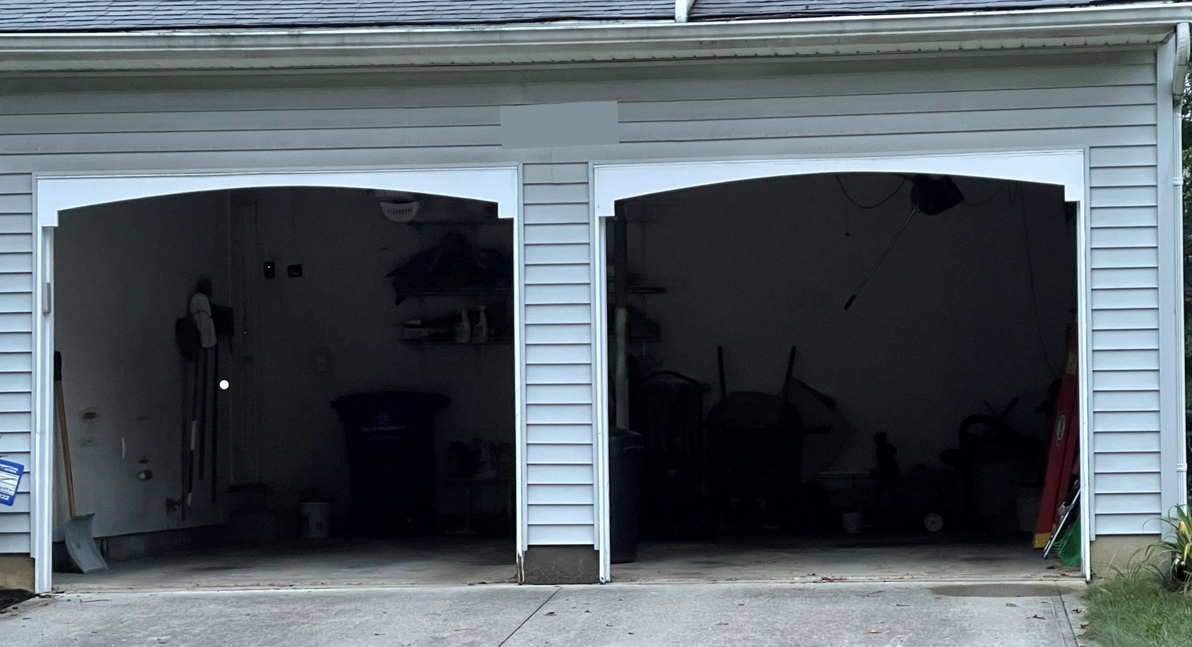 Before Replacement: Two side-by-side 8-by-8 foot garage door openings