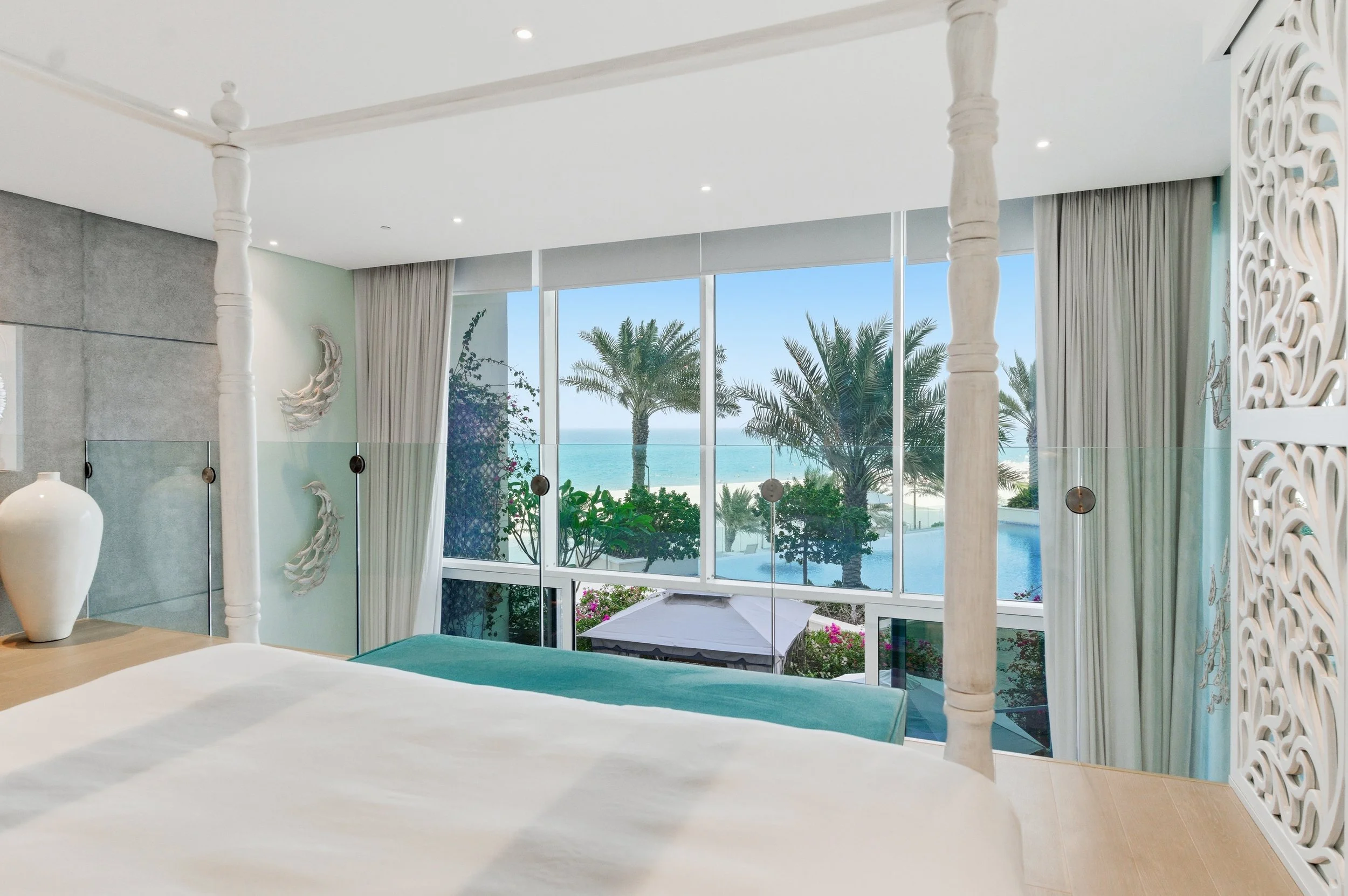 Master suite with stunning pool and ocean outlooks.