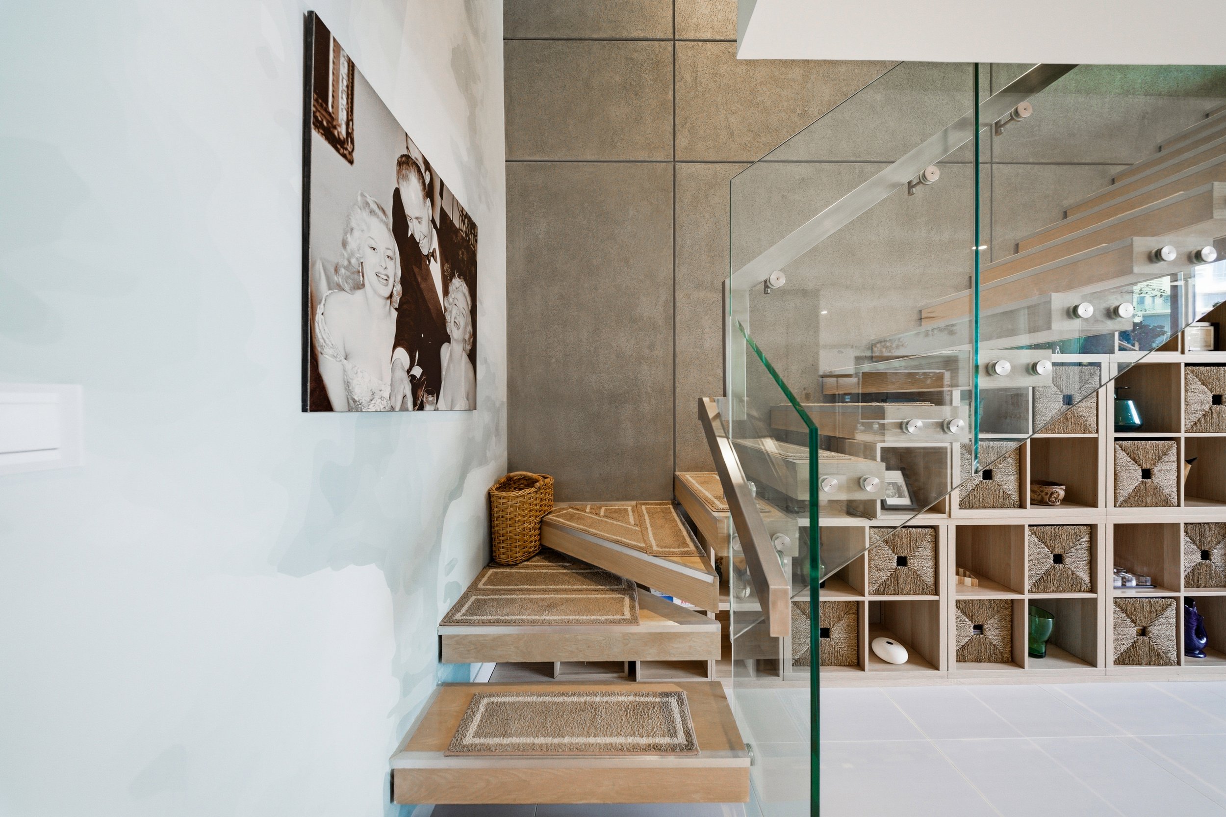 Modern staircase guiding you to your private loft hideaway.