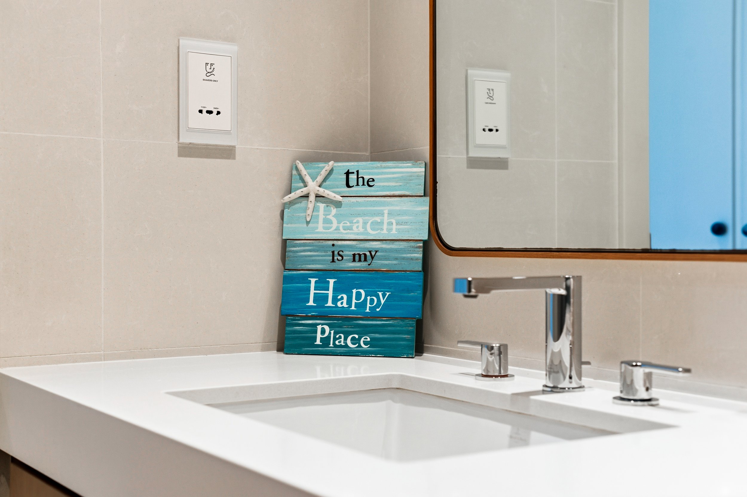 Generous sink and countertop with beach-inspired touches.