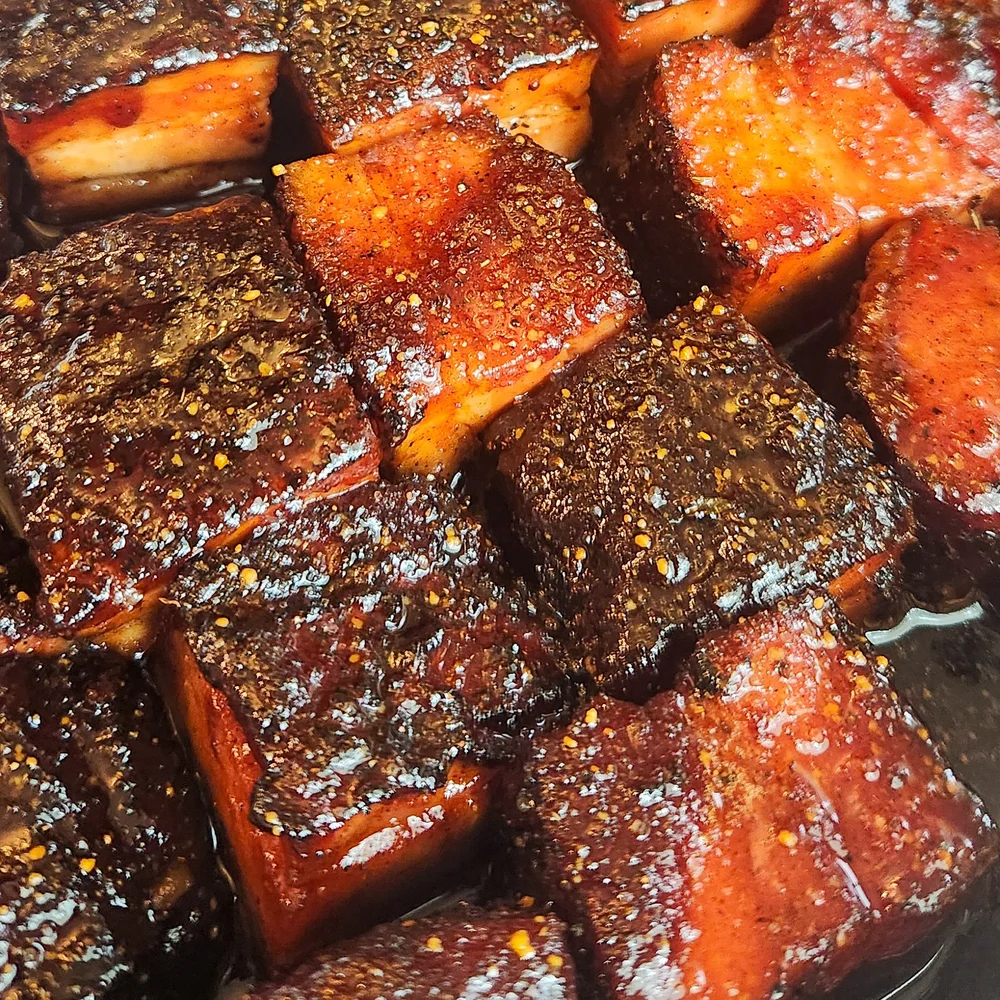 Glossy pork belly burnt ends fresh off the smoker
