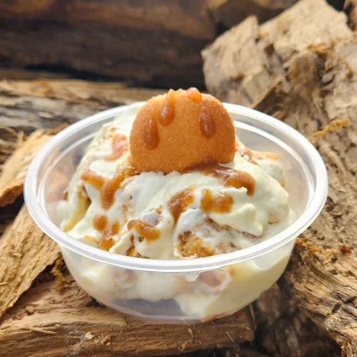 Bananas Foster pudding cup topped with a vanilla wafer